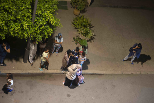 People take shelter and check for news after the earthquake in Rabat, Morocco.