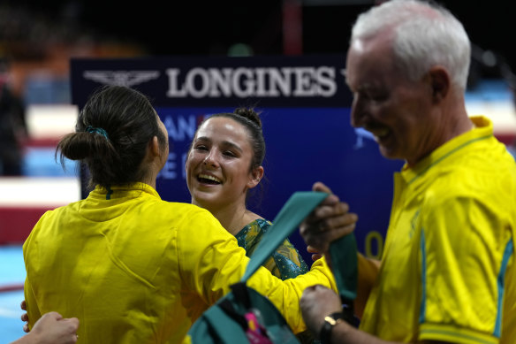 Godwin (left) embraces countrywoman and fellow Birmingham gold medallist Kate McDonald.