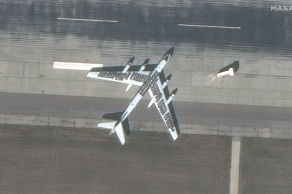 A satellite image from Maxar Technologies shows car tyres placed on top of two Tu-95 bombers at Engels airbase near Saratov, Russia.