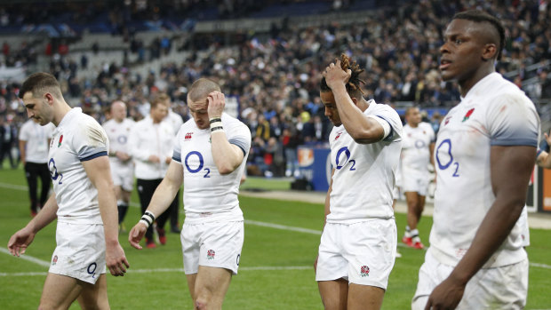 Anthony Watson, second right, looks disconsolate with teammates after conceding the Six Nations title.