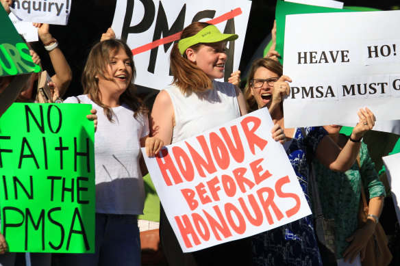 Protesters gather outside Somerville House.