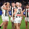 The dejected Magpies after their loss to the Bulldogs at Marvel Stadium on Saturday night.