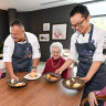 Aged care chefs David Martin and Harry Shen present residents at St Vincent’s Care Services Kew with their latest culinary creations.