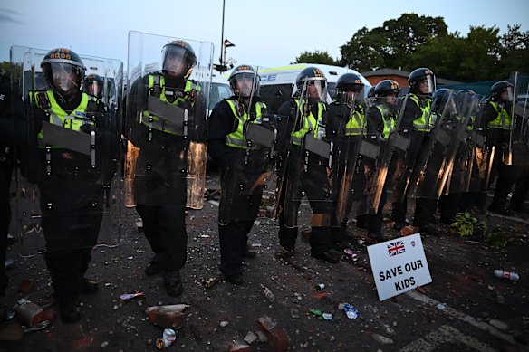  A sign which reads 'Save our kids' is displayed on the ground in front of riot police as protesters gather near the location where Henry Nowak died during a demonstration over the Police's handling of the incident, on June 2, 2026 in Southampton, England. Far-right and nationalist groups have actively organised demonstrations and vigils following revelations from the ongoing murder trial of 18-year-old student Henry Nowak. The case involves the fatal stabbing of Nowak in Southampton in December 2025 by Vickrum Digwa. Court details revealed that Digwa falsely claimed to arriving officers that he was the victim of a racist attack, leading responding police to temporarily handcuff the fatally wounded teenager before discovering his injuries.