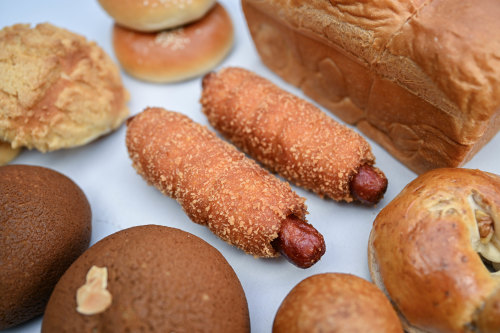 The “fried sausage roll” (centre) is wrapped in milk bread rolled in panko crumbs.