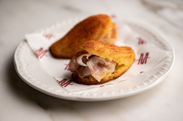 𝄒Nduja madeleine with preserved lemon and guanciale.