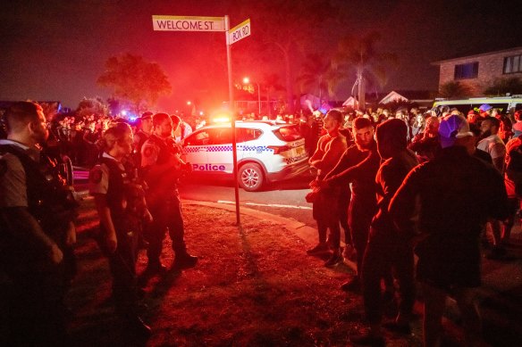 An angry crowd confronted police after a stabbing at a church in Wakeley. 