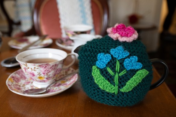 Teapots are kept warm with hand-knitted cosies.