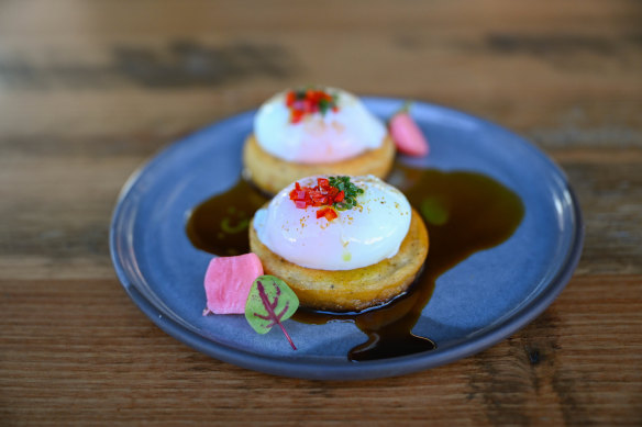 Lentil pancakes and poached eggs and dressed with lamb jus.