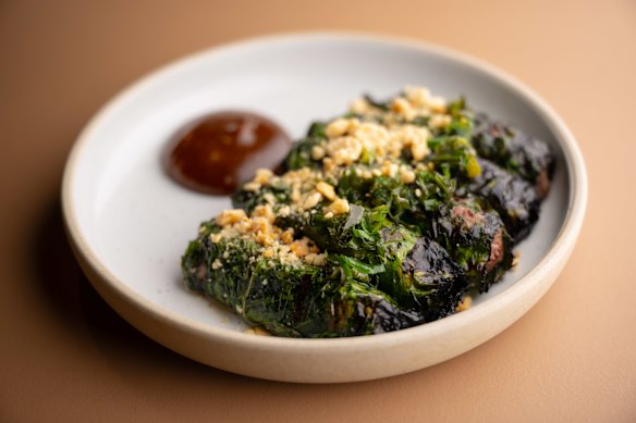 Wagyu beef in betel leaf with peanut dipping sauce.