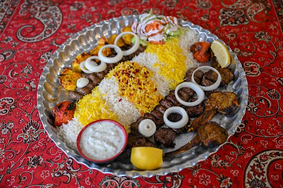 The Maryam special plate with kebab, saffron rice, dip and vegetables.