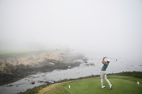 Luke Poulter hits from the 17th tee during Walker Cup golf matches at Cypress Point Club in Pebble Beach, California.