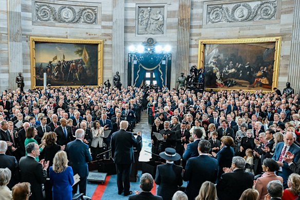 President Donald Trump attends his inauguration in the US Capitol Rotunda.