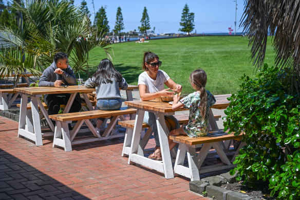 Picnic tables in the kiosk’s small paved area on the beach side.
