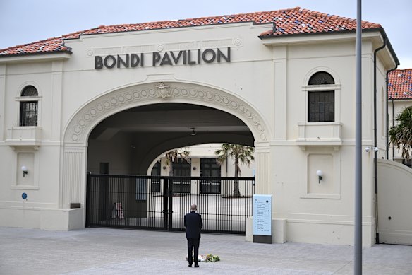 Cold distance: Anthony Albanese cuts a solitary figure as he attends the Bondi Pavilion the day after the mass shooting.