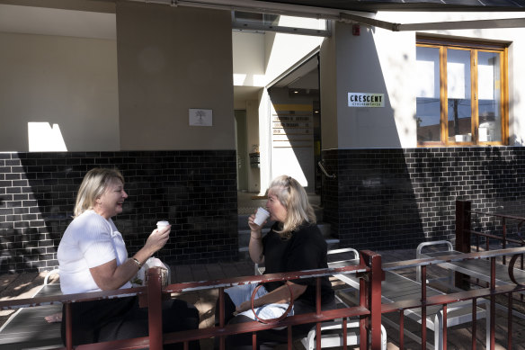 Enjoy your croissant in the small outdoor seating section.