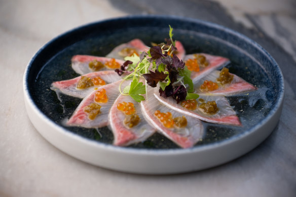 “New style” kingfish sashimi with salmon roe, pickled jalapeno and truffled dashi. 