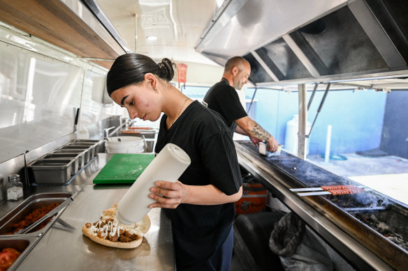 Ismail Tosun (rear) runs the food truck with his daughter Tali.