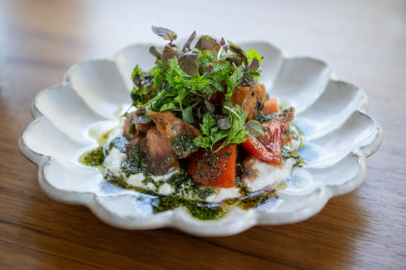 A panzanella salad with rustic chunks of heirloom tomato and chewy sourdough croutons.