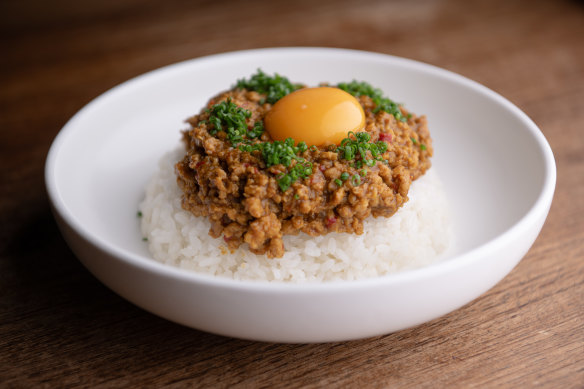 Keema curry (dry curry with chicken mince, rice and egg).