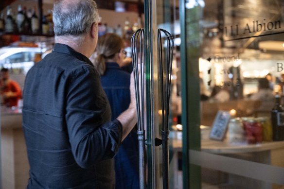The Chefs’ Warehouse giant whisk has been reimagined as a door handle.