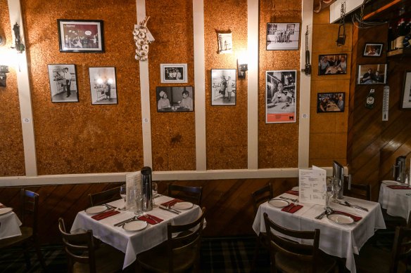The dining room’s cork-lined walls are decorated with mementos and photographs.