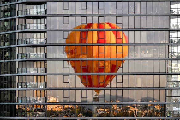 Reflection of a hot air balloon on a Docklands building.