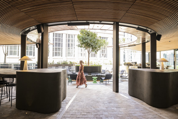 A new copper and glass awning shields guests from the elements.