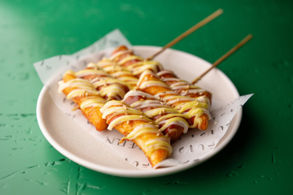 Chicken sausages skewered with tteokbokki.