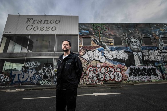 Van Buuren in front of the Franco Cozzo building, pre-renovation.