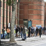 A long queue for voting at Drill Hall in the City of Melbourne on Friday afternoon.