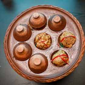 Tiny clay pots hide hor mok at Pa Tong.