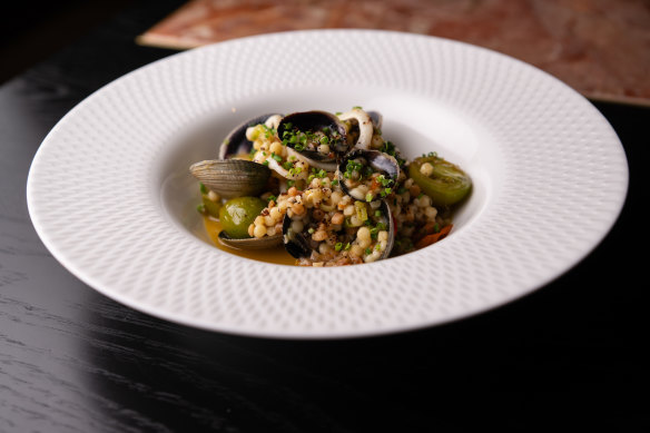 Fregola with clams, calamari and anchovy butter is considered and confident.