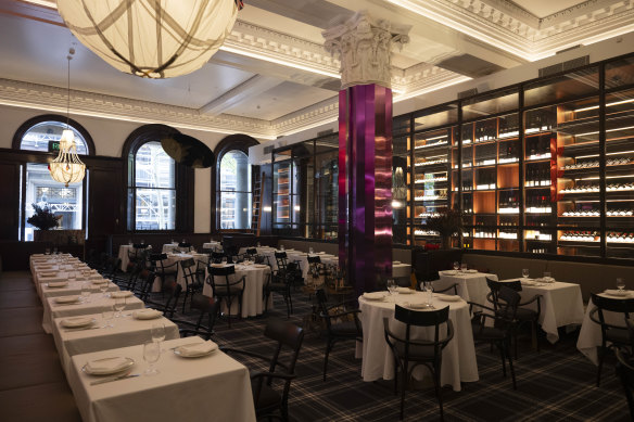 Carpet and curtains soften the former Seta space, while a mirrored purple pillar adds colour.