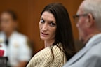 Lindsay Clancy speaks with her lawyer Kevin Reddington during proceedings in her murder trial.
