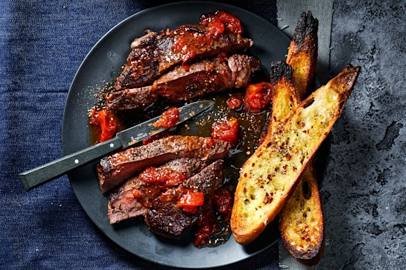 This easy steak dish is packed with flavour thanks to roasting tomatoes with anchovies and garlic.