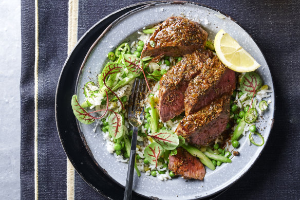 Jerk-spiced lamb with pickle rice salad and peas.