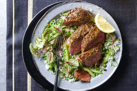 Jerk-spiced lamb with pickle rice salad and peas.