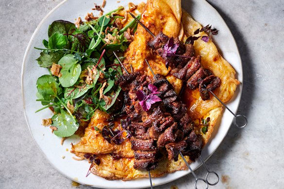Xinjiang lamb skewers with crispy egg pancakes.