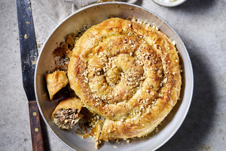 Serve this lamb, rice and vine leaf borek with garlic dip.