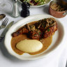 Builders Arms’ rotating rotisserie chicken special is currently served with potato puree and mushroom sauce (pictured).