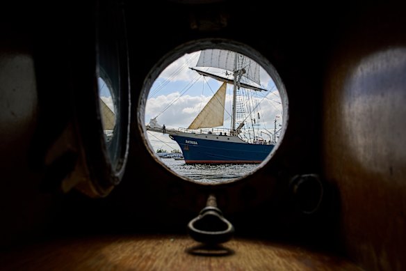 The barkentine Antigua passes as hundreds of tall ships sailed into the Dutch capital’s harbor for the 10th edition of SAIL, in Amsterdam.