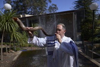 A Rabbi blows the ram’s horn at a synagogue in Sydney.  