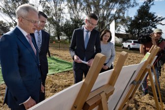Federal Urban Infrastructure Minister Paul Fletcher. left, and NSW Premier Dominic Perrottet at Badgerys Creek on Thursday.