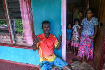Nar Deo, with his family in the Muanidevo settlement, Dreketi.  Dust from the Chinese owned Aurum Exploration, bauxite mine is constantly causing them health issues.