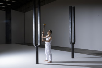 Performer Ryuichi Fujimura with Mel O’Callaghan’s artwork. The tuning forks are part of the <i>All is Life</i> exhibition at Carriageworks.