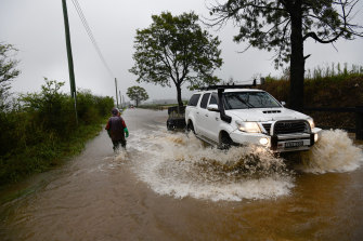 Pitt Town farmers evacuating farm equipment as heavy rains soaked the region.