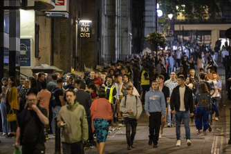 A long queue of club-goers waiting to get into a nightclub in London.