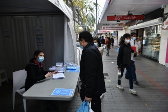 A marquee outside Priceline at Cabramatta is offering information to the local community about AstraZeneca shots available inside.