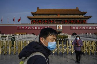 A Chinese couple at the Tiananmen Gate in Beijing.